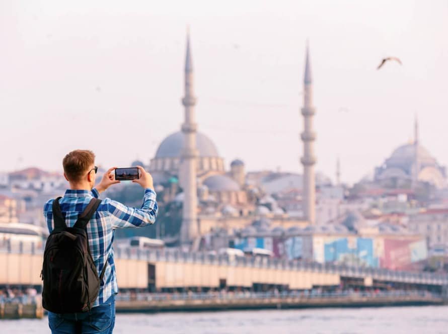 A-picture-of-a-tourist-photographing-the-Blue-Mosque-in-Türkiye