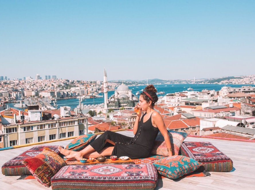 A-picture-of-a-tourist-relaxing-in-one-of-the-hotels-overlooking-the-Blue-Mosque-in-Türkiye